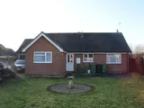 Well constructed detached bungalow with double garage and south facing rear garden in quiet village location